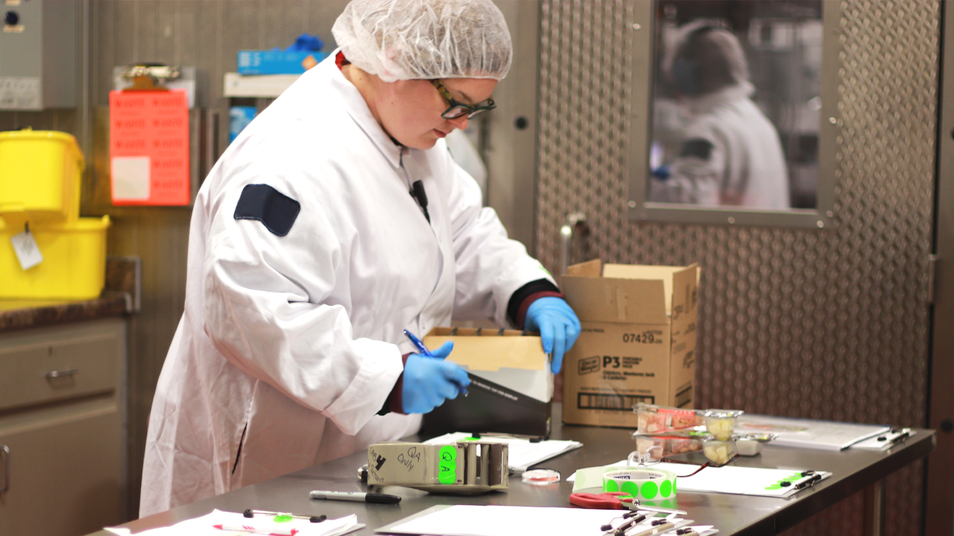 worker in packaging facility