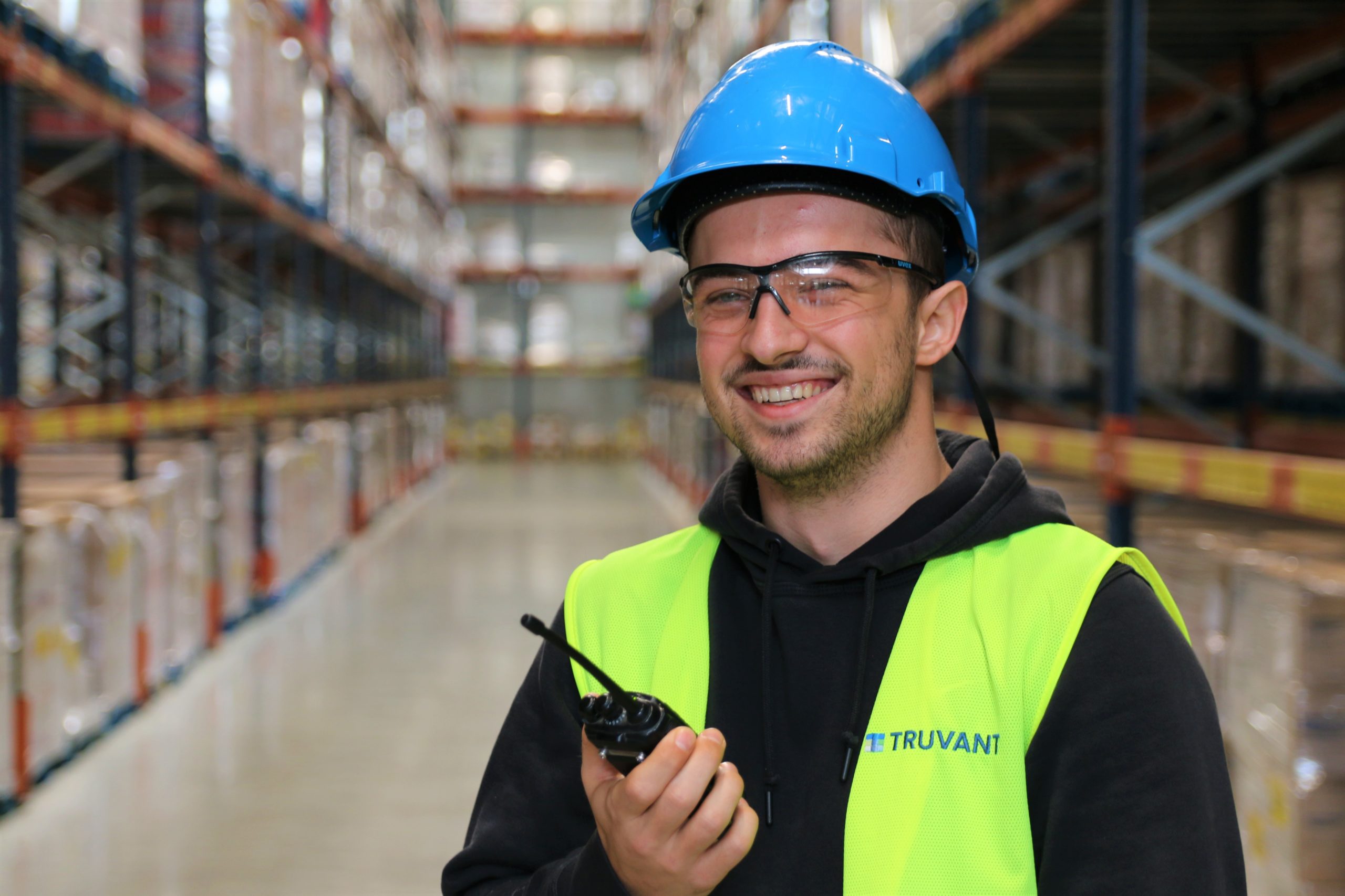 Worker at warehouse wearing helmet